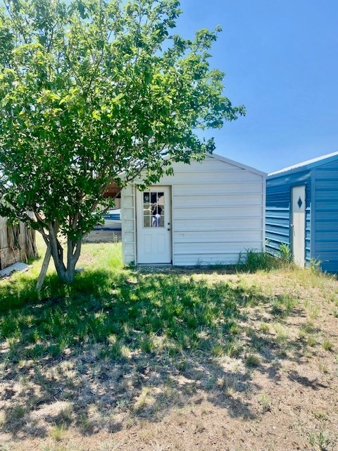 8882 Fm 765, San Angelo, TX 76905 - view of outdoor structure featuring an outbuilding and fence