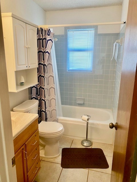 8882 Fm 765, San Angelo, TX 76905 - bathroom featuring tile patterned flooring, toilet, vanity, and shower / tub combo