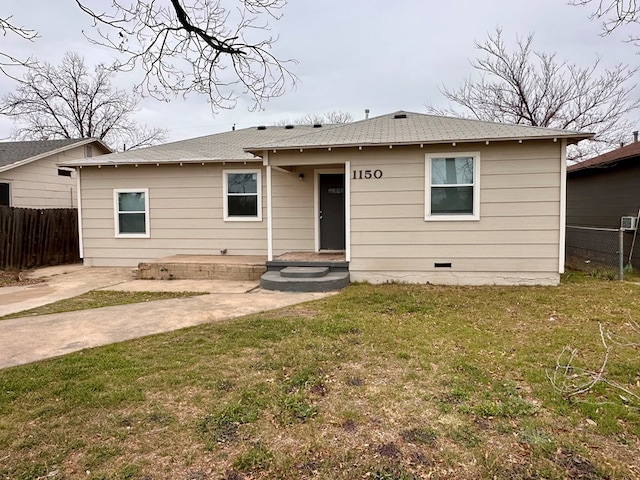 rear view of house with a yard and a patio area