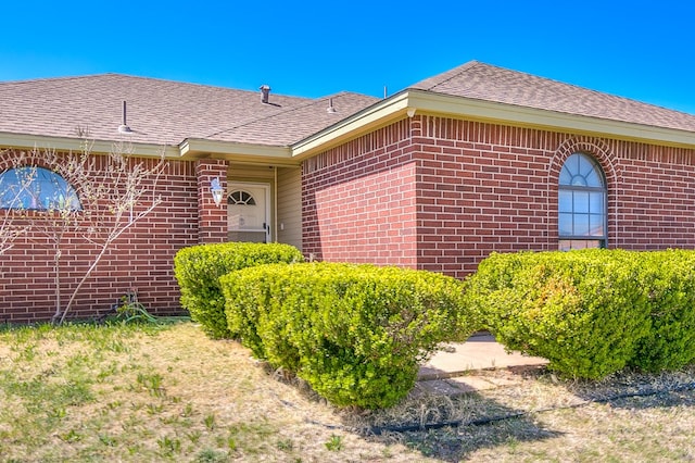 1605 Amberton Pkwy, San Angelo, TX 76901 - doorway to property with brick siding and a shingled roof