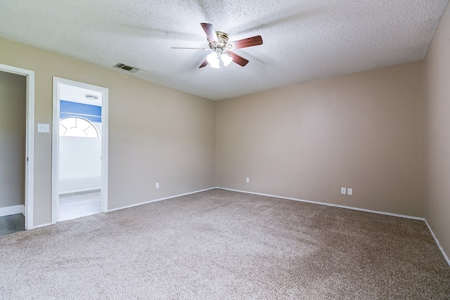 1605 Amberton Pkwy, San Angelo, TX 76901 - carpeted empty room featuring a ceiling fan, a textured ceiling, and baseboards