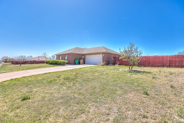 1605 Amberton Pkwy, San Angelo, TX 76901 - view of front of home with a garage, concrete driveway, and brick siding