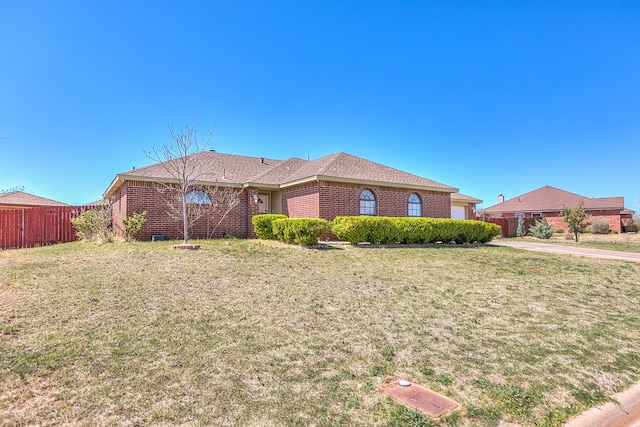 1605 Amberton Pkwy, San Angelo, TX 76901 - view of front facade featuring brick siding and a garage