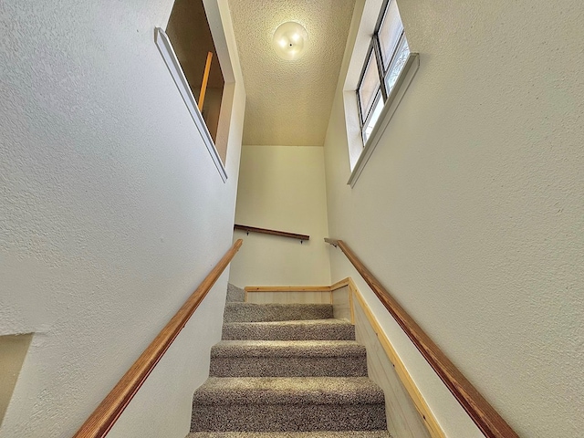 1036 Glenna Dr, San Angelo, TX 76901 - staircase featuring a textured wall