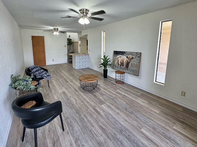 1036 Glenna Dr, San Angelo, TX 76901 - sitting room with wood finished floors and ceiling fan