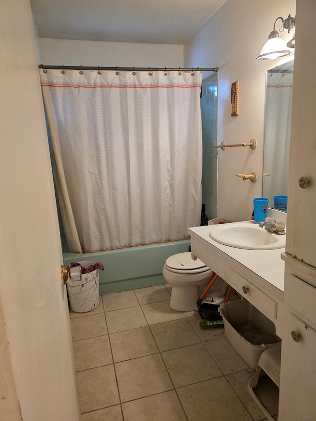 233 Robin Hood Trl, San Angelo, TX 76901 - bathroom featuring toilet, vanity, tile patterned flooring, and shower / bath combo