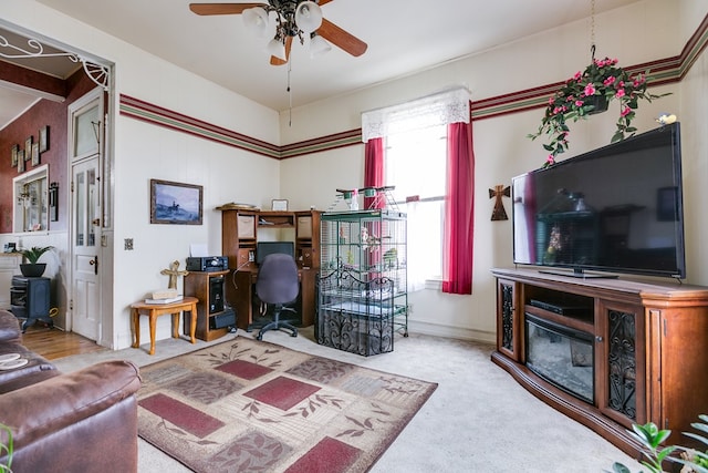 carpeted office space with a healthy amount of sunlight and ceiling fan