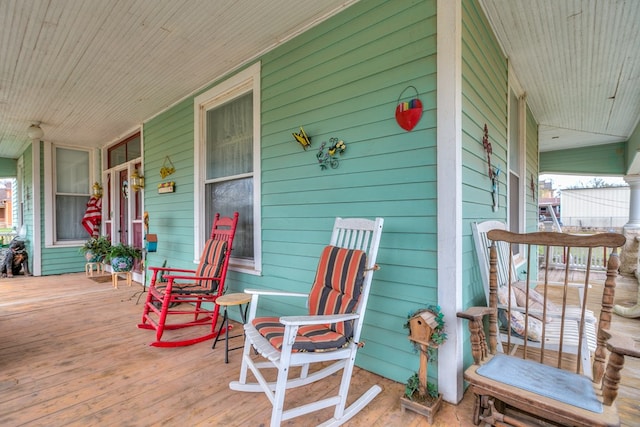 wooden terrace featuring covered porch