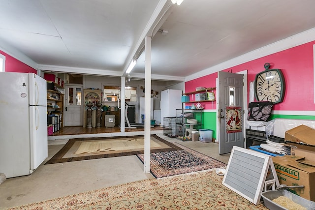 basement with white fridge