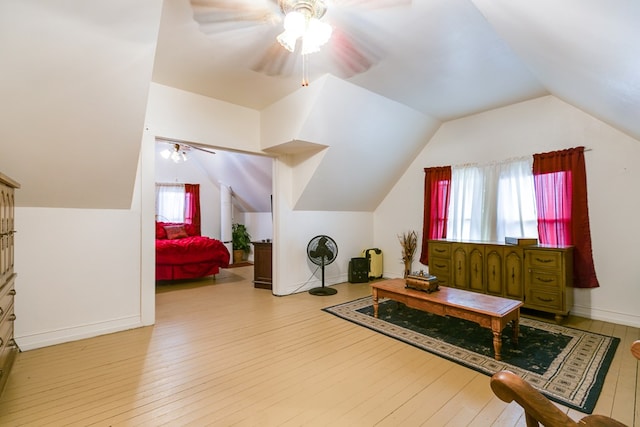 additional living space featuring ceiling fan, lofted ceiling, and light hardwood / wood-style flooring