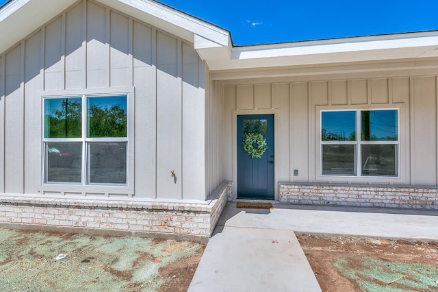 2122 Deaton St, San Angelo, TX 76903 - doorway to property featuring board and batten siding