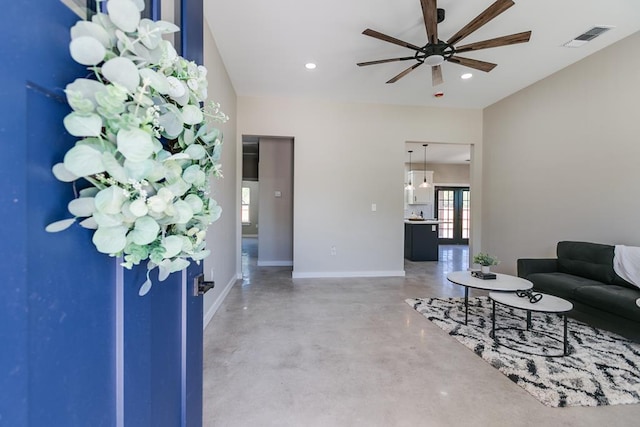 2122 Deaton St, San Angelo, TX 76903 - living room featuring concrete flooring, ceiling fan, baseboards, and recessed lighting