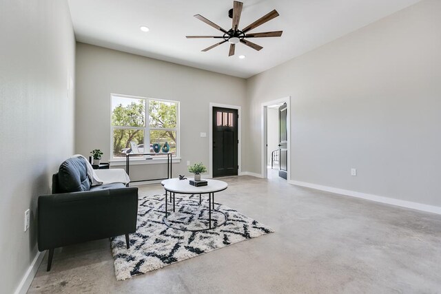 2122 Deaton St, San Angelo, TX 76903 - living room featuring finished concrete floors, ceiling fan, baseboards, and recessed lighting