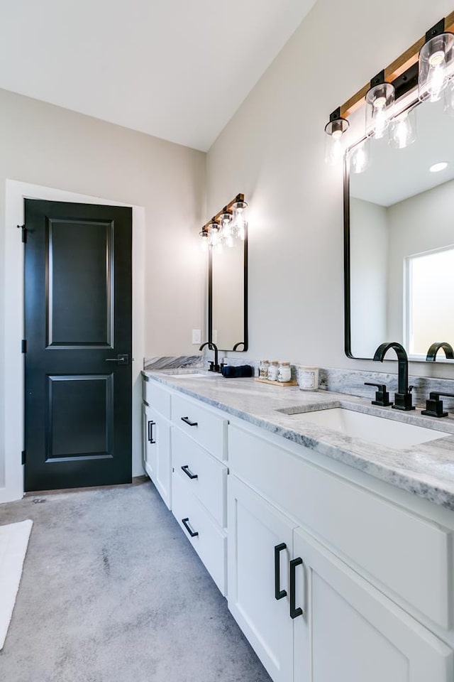 2122 Deaton St, San Angelo, TX 76903 - bathroom featuring concrete floors and double vanity