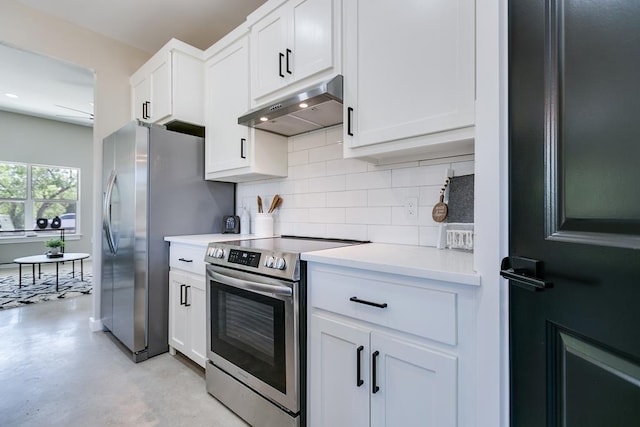 2122 Deaton St, San Angelo, TX 76903 - kitchen with stainless steel appliances, under cabinet range hood, tasteful backsplash, and light countertops