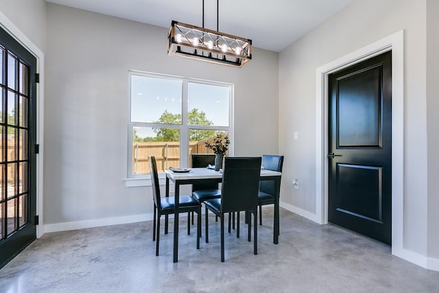 2122 Deaton St, San Angelo, TX 76903 - dining room featuring finished concrete floors, plenty of natural light, and baseboards