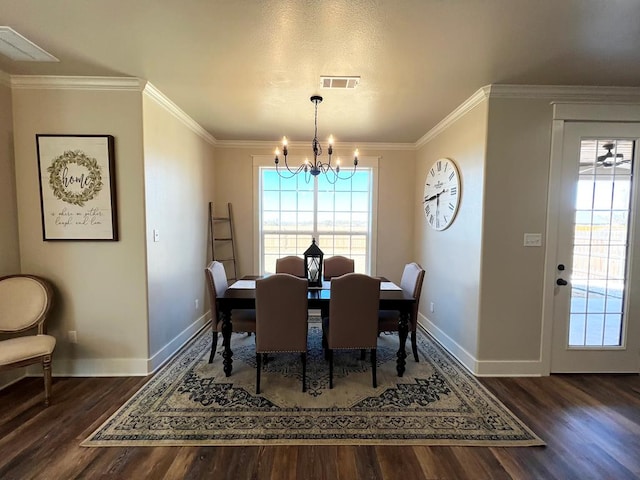 1962 Beaty Rd, San Angelo, TX 76904 - dining room with a chandelier, wood finished floors, baseboards, and ornamental molding