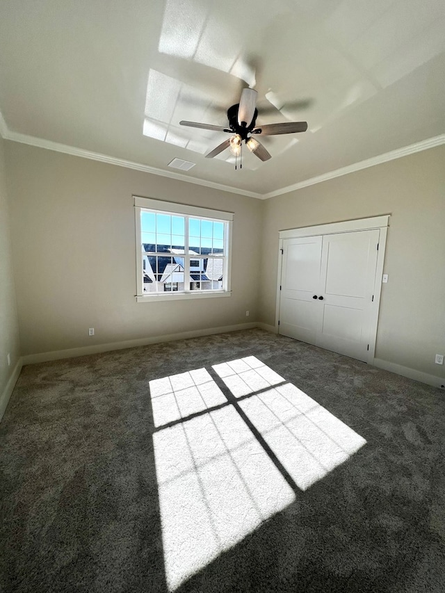 1962 Beaty Rd, San Angelo, TX 76904 - unfurnished bedroom with carpet flooring, baseboards, ornamental molding, and a ceiling fan