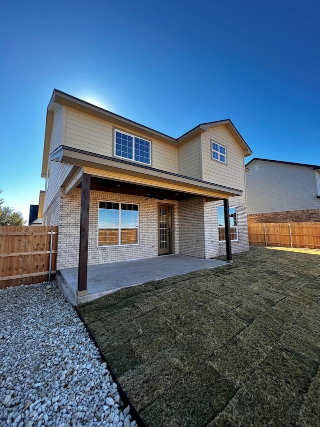1962 Beaty Rd, San Angelo, TX 76904 - back of house featuring brick siding and a patio area