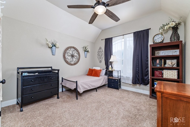 bedroom featuring carpet floors, baseboards, and vaulted ceiling