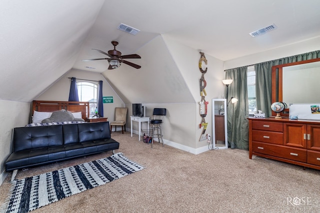 bedroom with vaulted ceiling, baseboards, visible vents, and carpet floors