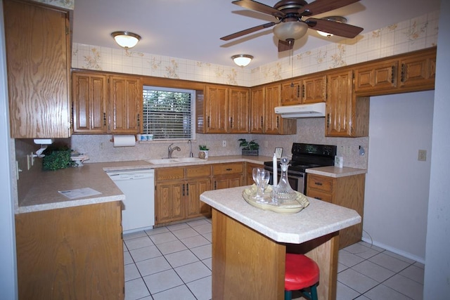 kitchen with light tile patterned flooring, a breakfast bar, sink, electric range, and white dishwasher