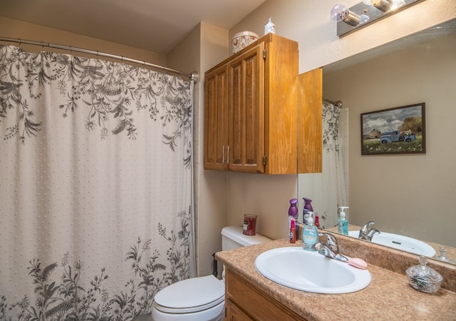 bathroom with vanity, a shower with curtain, and toilet