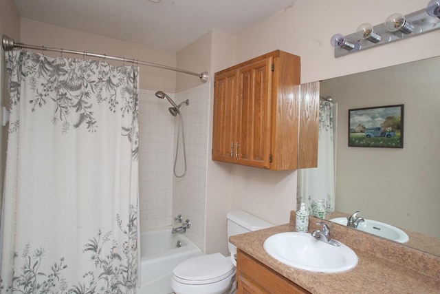 full bathroom featuring vanity, shower / bath combo, and toilet