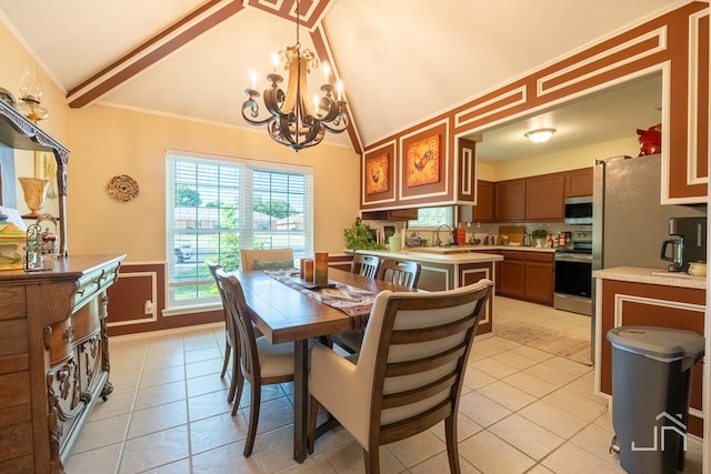 dining space with sink, ornamental molding, light tile patterned flooring, vaulted ceiling, and a chandelier