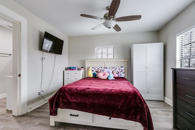 bedroom featuring ceiling fan and light hardwood / wood-style floors