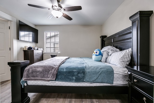 bedroom featuring hardwood / wood-style floors and ceiling fan