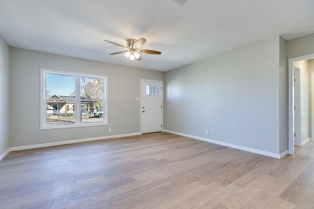 entrance foyer with ceiling fan and light wood-type flooring