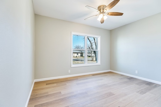 unfurnished room featuring light hardwood / wood-style floors and ceiling fan