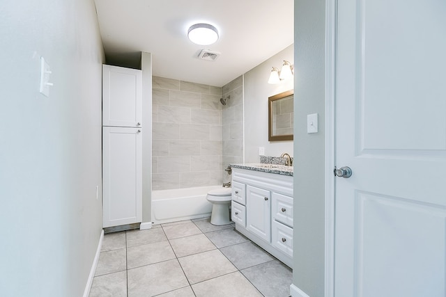 full bathroom featuring tiled shower / bath combo, vanity, tile patterned floors, and toilet