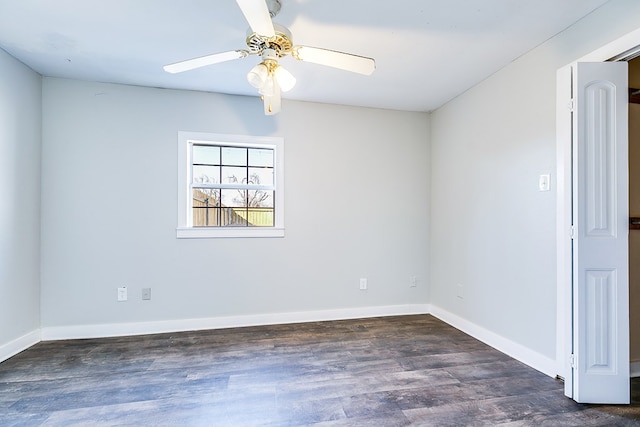 empty room featuring ceiling fan and dark hardwood / wood-style flooring