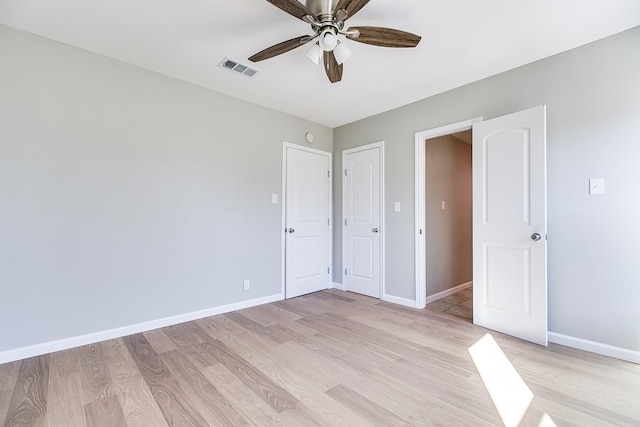 unfurnished bedroom featuring ceiling fan and light wood-type flooring