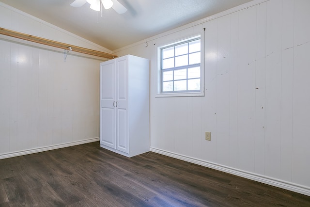 2113 S Hill St, San Angelo, TX 76903 - basement with dark wood finished floors, a ceiling fan, and baseboards