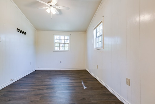 2113 S Hill St, San Angelo, TX 76903 - empty room with healthy amount of natural light, lofted ceiling, ceiling fan, dark wood-style floors, and baseboards