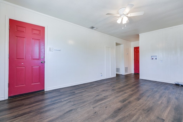 2113 S Hill St, San Angelo, TX 76903 - unfurnished room with crown molding, dark wood-style floors, a ceiling fan, and baseboards