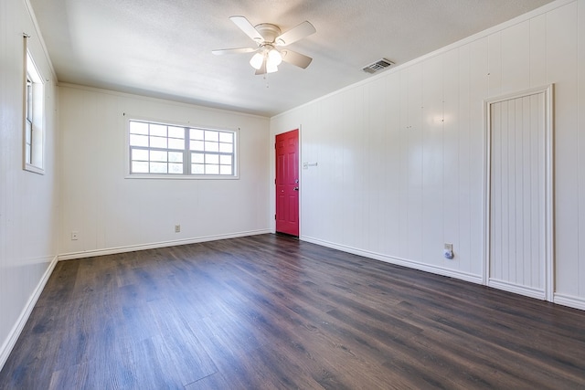 2113 S Hill St, San Angelo, TX 76903 - empty room with dark wood finished floors, ceiling fan, ornamental molding, and baseboards