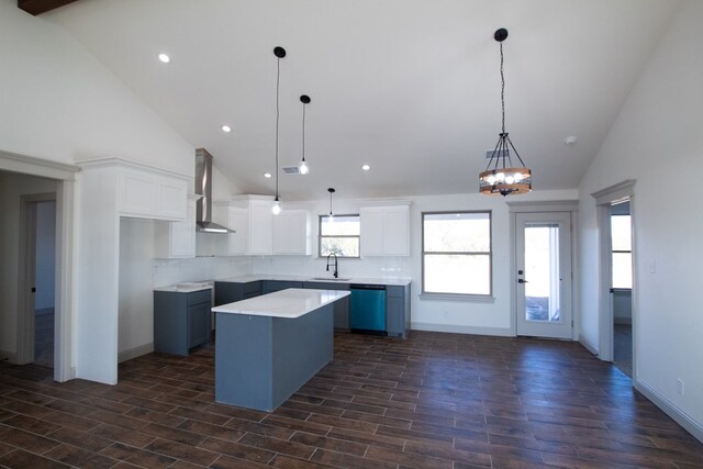 9614 Bighorn Trl, San Angelo, TX 76901 - kitchen with wall chimney exhaust hood, a sink, a kitchen island, decorative backsplash, and dishwasher