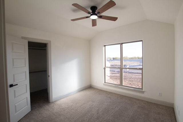 9614 Bighorn Trl, San Angelo, TX 76901 - unfurnished bedroom with lofted ceiling, a spacious closet, carpet floors, baseboards, and ceiling fan