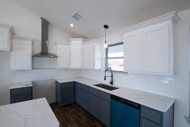 9614 Bighorn Trl, San Angelo, TX 76901 - kitchen featuring dishwashing machine, wall chimney exhaust hood, a sink, light stone counters, and white cabinets