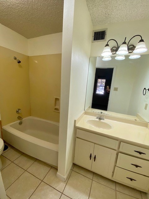 full bathroom with a textured ceiling, tile patterned flooring, vanity, and visible vents