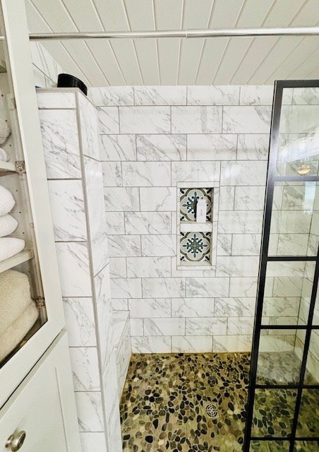 full bath featuring tiled shower