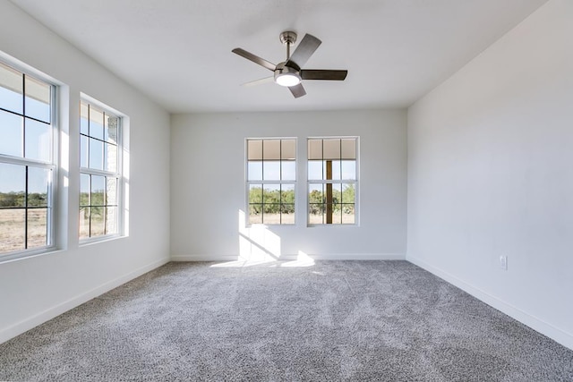 empty room featuring carpet floors and ceiling fan