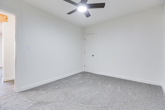 spare room featuring carpet floors and ceiling fan