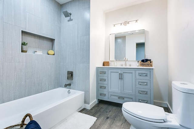 full bathroom with vanity, toilet, shower / bath combination, and hardwood / wood-style floors