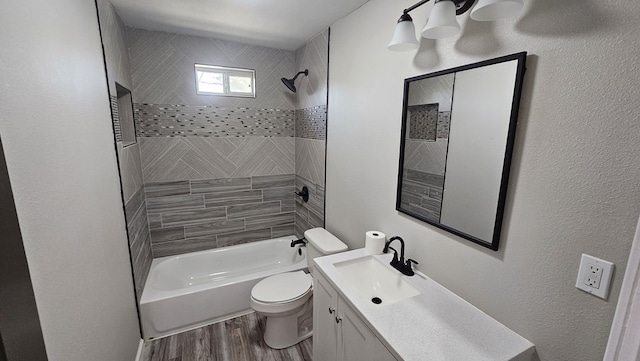 2514 S Hill St, San Angelo, TX 76903 - bathroom featuring toilet, vanity, bathtub / shower combination, and wood finished floors