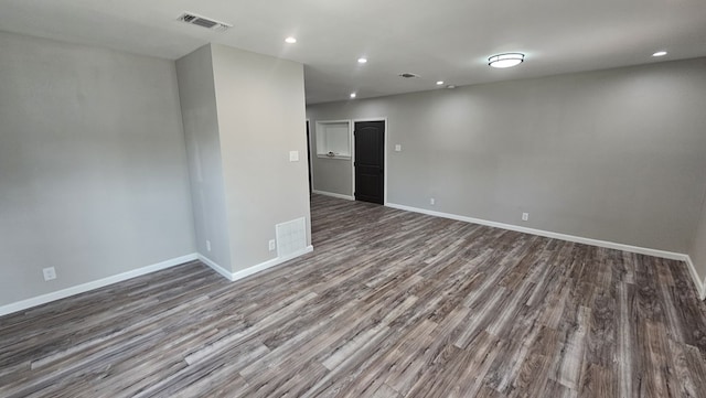 2514 S Hill St, San Angelo, TX 76903 - spare room featuring baseboards, recessed lighting, wood finished floors, and visible vents